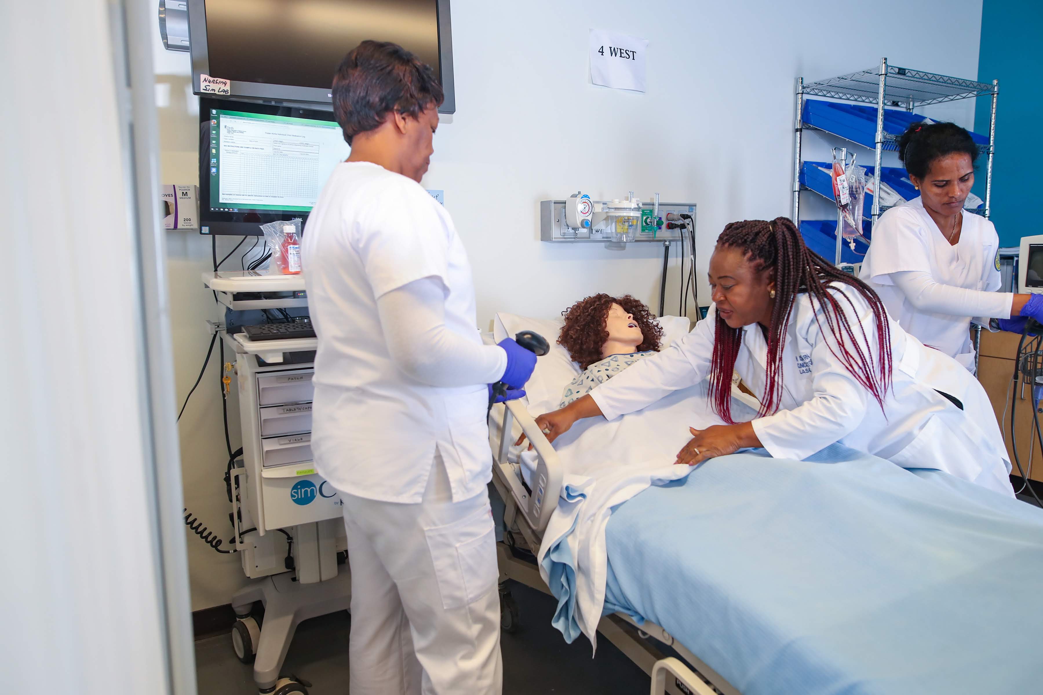 Nursing students practicing on patient